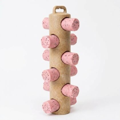 Standaard met roze cilindervormige objecten erin geplaatst.